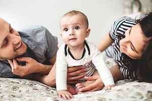 Family with Young Baby Looking at Camera